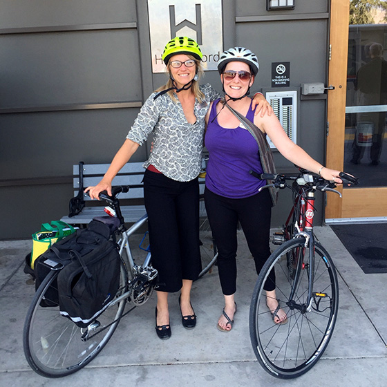 Katie and Karissa biking to work
