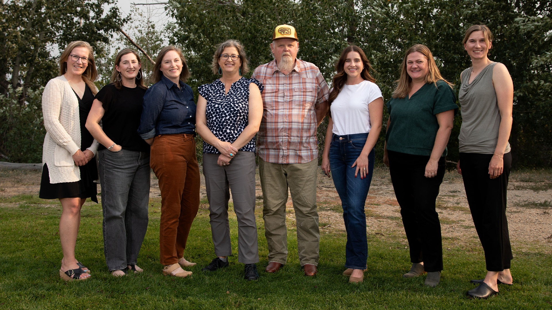 Eight Homeword board members posing together at our 30th anniversary celebration