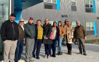 CJCC and CAC representatives in front of Blue Heron Place