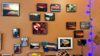 Some of Jason's art displayed on a wall in his home