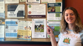 Keira pointing to a flyer she posted